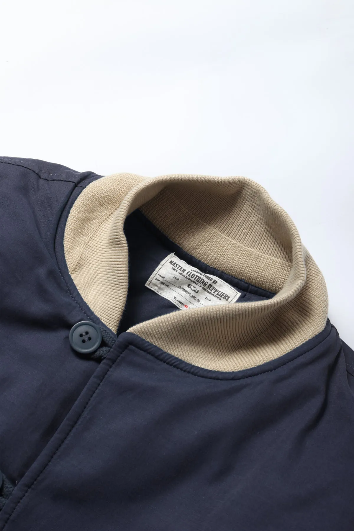 Sure, here is the optimized title for the e-commerce product: Navy Quilted Bomber Jacket by Okonkwo Manufacturing.